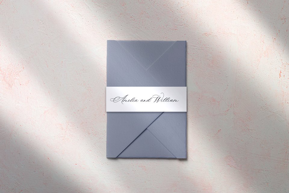 White Belly Band wrapped around wedding envelope