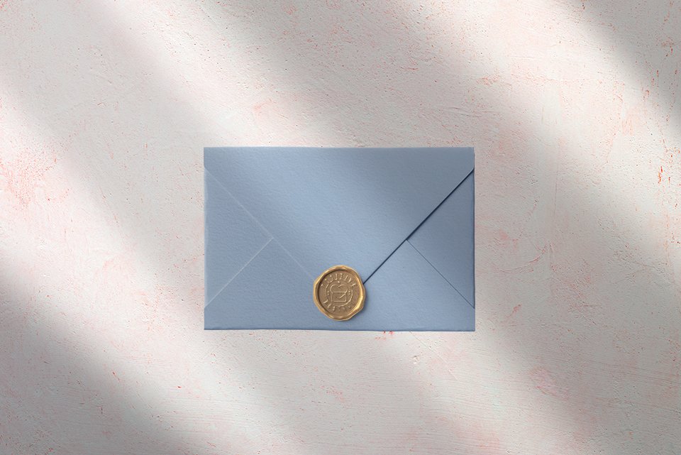 Wedding Envelope embellished with golden wax seal.