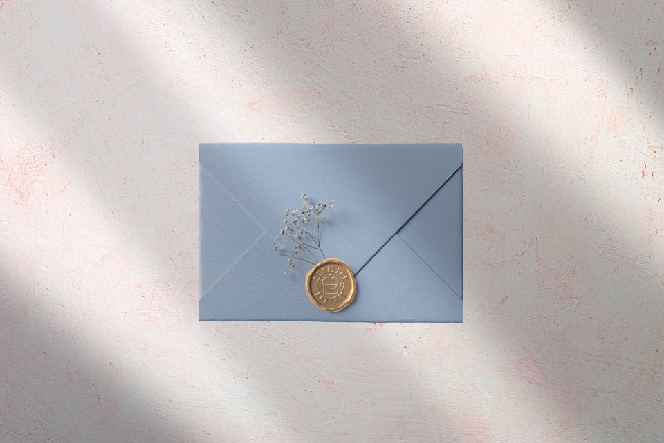 Wedding Envelope embellished with dried flowers and gold wax seal.